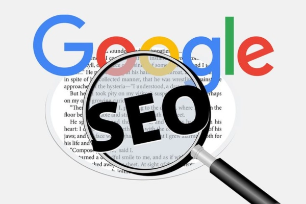 Freelance Digital Marketing Expert in Riyadh.the word "Google" in its multi-color font at the top. Below the text is an open book with visible English text. A black magnifying glass with the letters "SEO" in the lens is positioned on the right, as if searching the text for keywords.